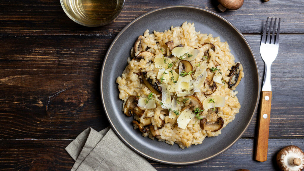Beautiful Mushroom Risotto Wallpaper: Rustic Table & Fresh Herbs