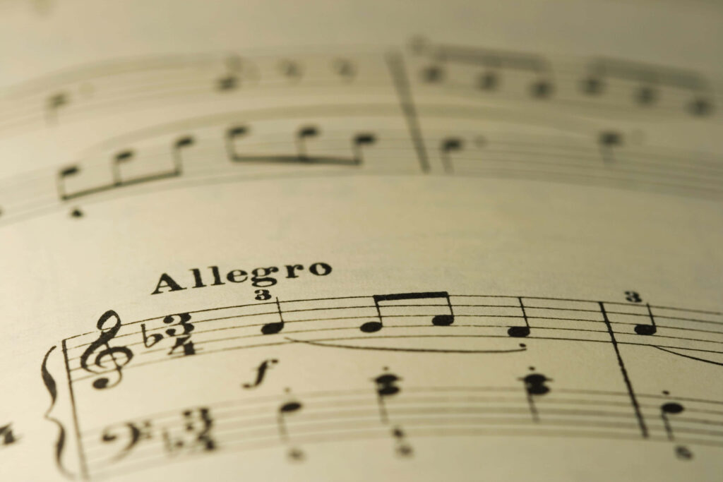 Elegant Musical Score Wallpaper: Close-Up of Allegro Notes