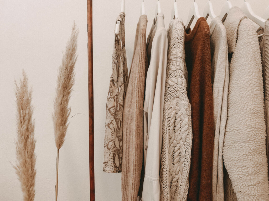 Timeless Elegance: Captivating Beige Fashion Staples on Display Wallpaper