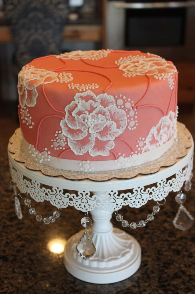 Elegant Pink Cake with Floral Designs on Crystal Cake Stand Wallpaper