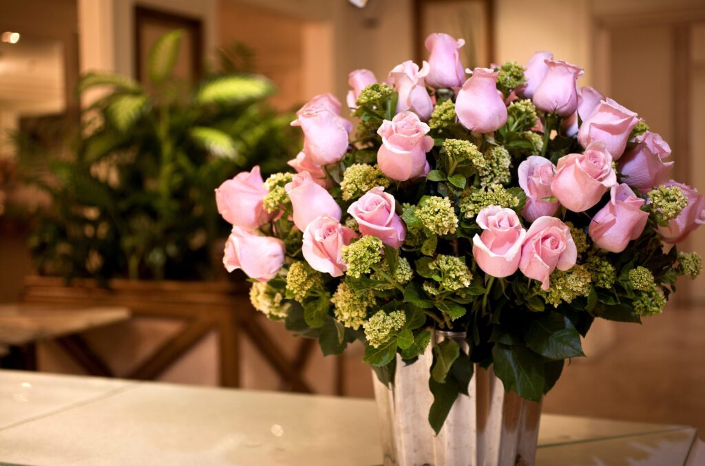 Elegant Pink Rose Bouquet Wallpaper with Lush Greenery Background