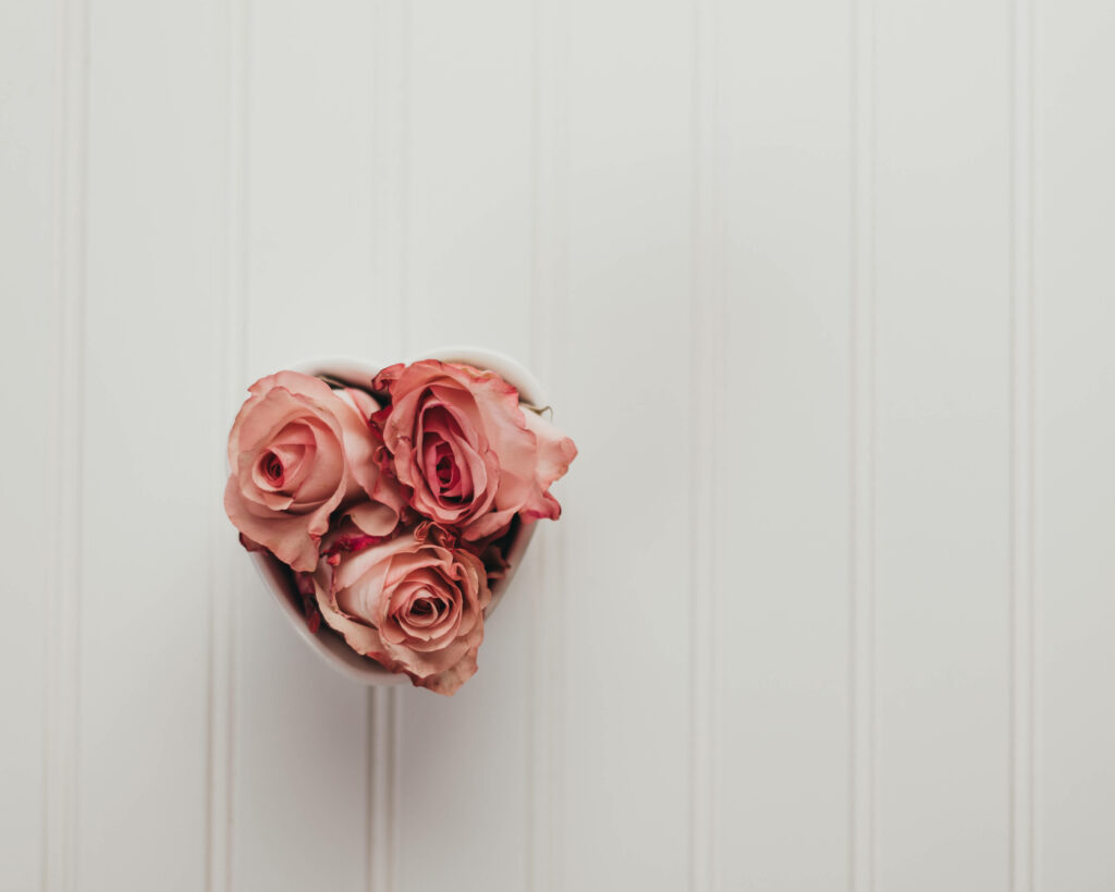 Elegant Pink Rose Heart Wallpaper on Minimal White Background
