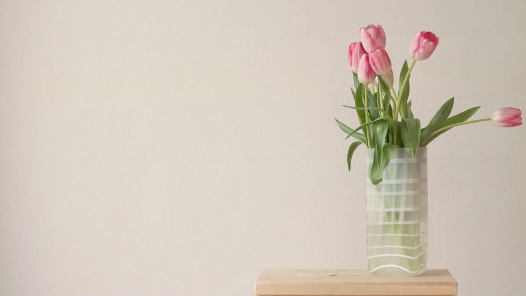 Elegant Spring Wallpaper: Pink Tulips in Translucent Vase on Beige