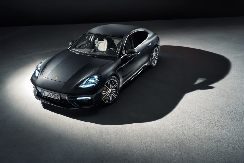 Sleek Porsche Panamera Front View: Luxurious Design & Dynamic Curves Wallpaper