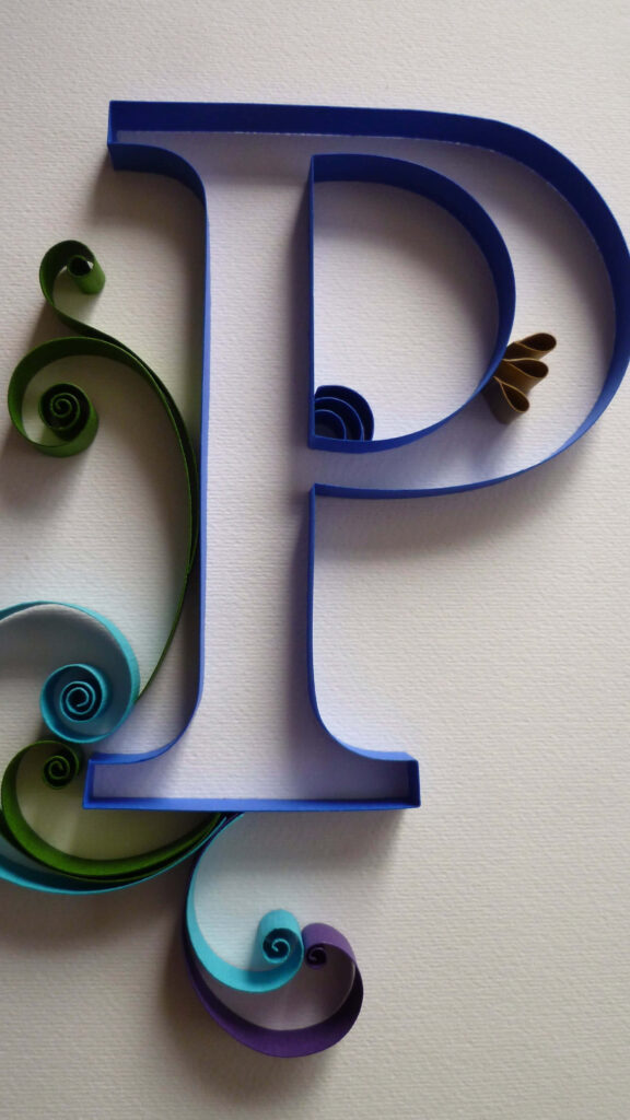 Colorful Quilling Art: Elegant Letter P Wallpaper Background