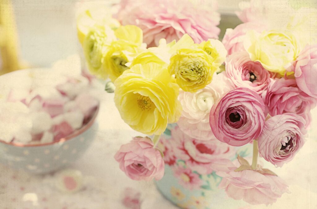 Elegant Ranunculus Flower Vase Wallpaper: Pink & Yellow Bliss