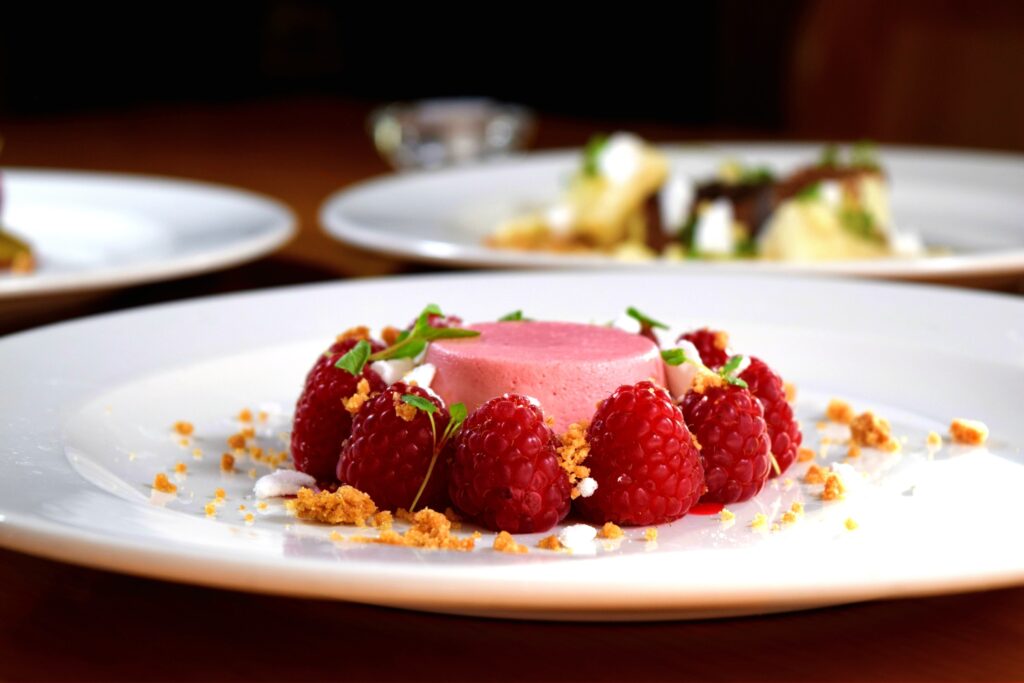 Elegant Raspberry Souffle Dessert with Fresh Raspberries - Wallpaper