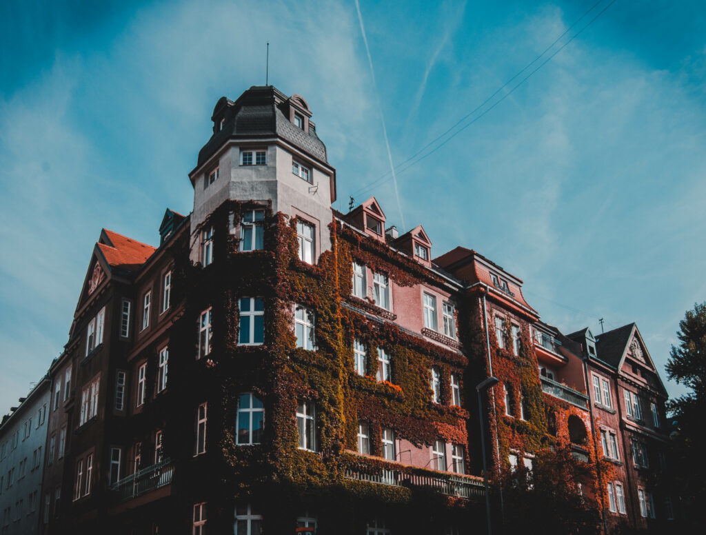 Elegant Historic Building Wallpaper with Vibrant Red-Brick Facade