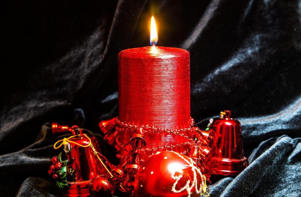 Elegant Red Candle Wallpaper: Festive Holiday Décor on Velvet
