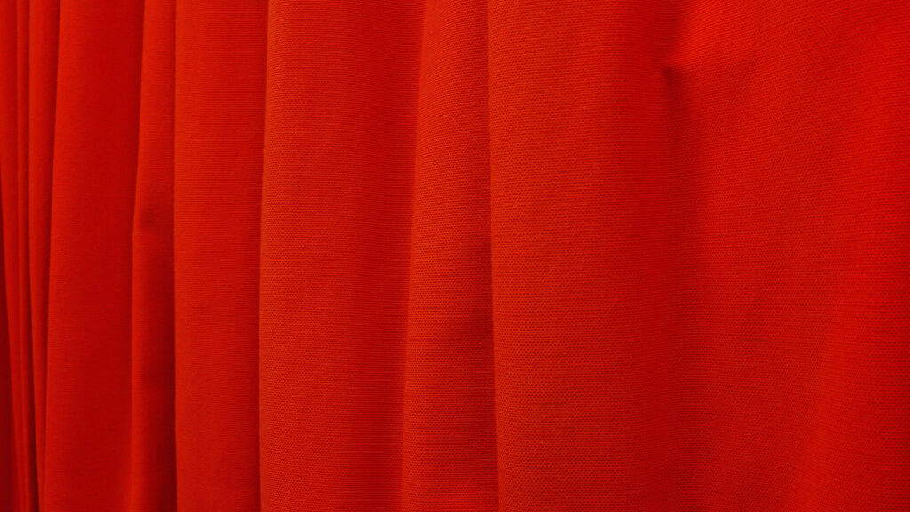 Elegant Red Curtain Wallpaper - Warm Fabric Texture Background