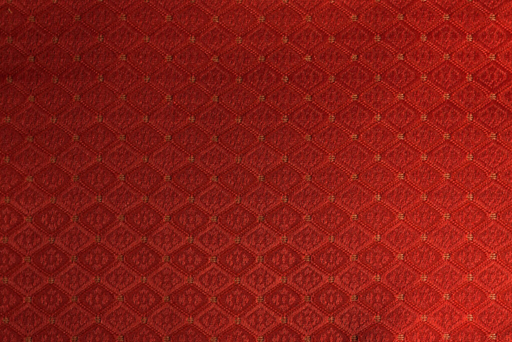 Rich Red Fabric Texture: Elegant Diamond Pattern Wallpaper Background