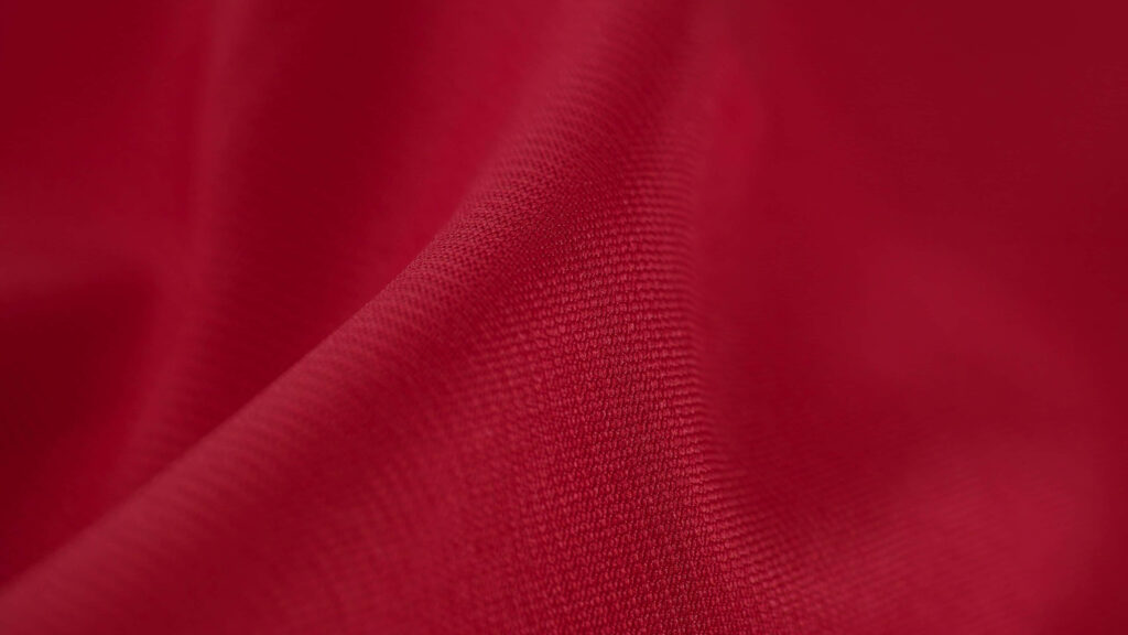 Elegant Red Fabric Close-Up: Soft Texture & Smooth Folds Wallpaper