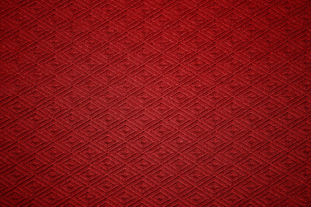 Elegant Red Fabric Wallpaper with Intricate Diamond Pattern Background