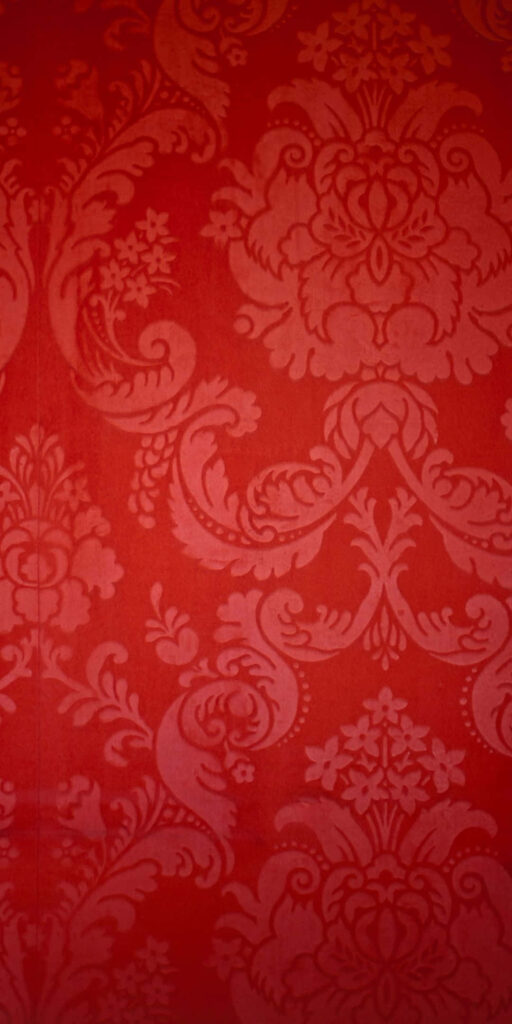 Elegant Red Floral Wallpaper: Intricate Ornamental Design Background
