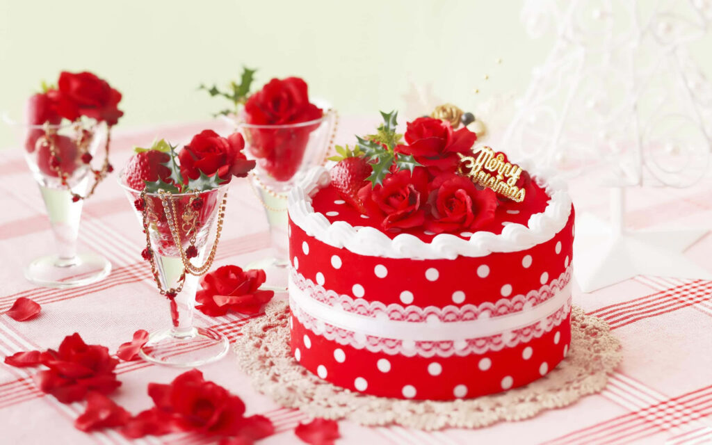 Vibrant red polka dot cake with red roses and greenery on lace doily pastel background wallpaper