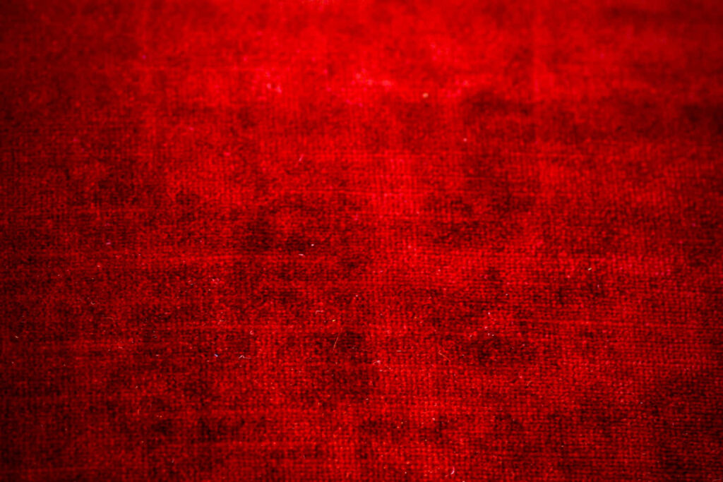 Elegant Red Textured Cloth Wallpaper - Vibrant Fabric Background