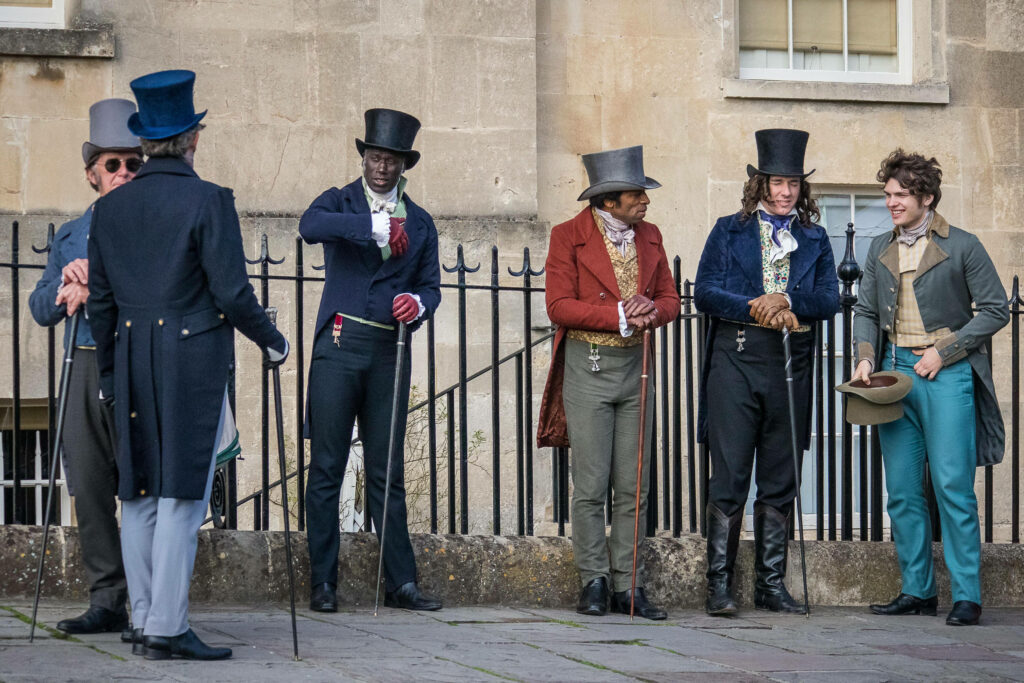 Regency Elegance: Gentlemen in Bridgerton-Style Attire Wallpaper
