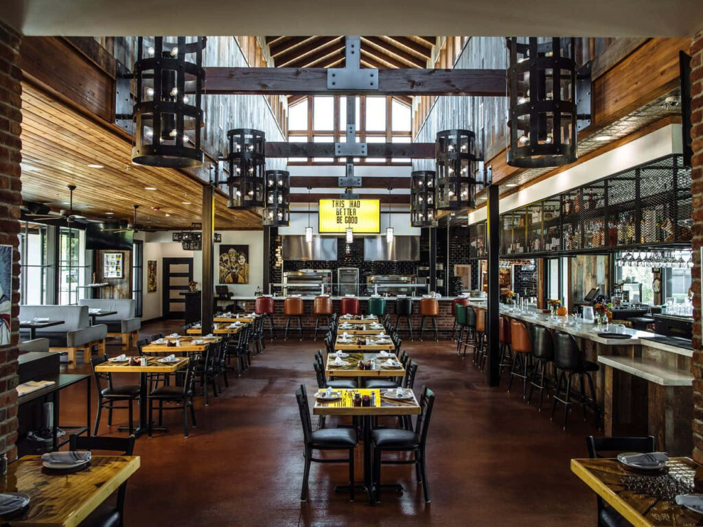 Chic Restaurant Interior: Warm Wood Accents & Modern Lighting Design Wallpaper