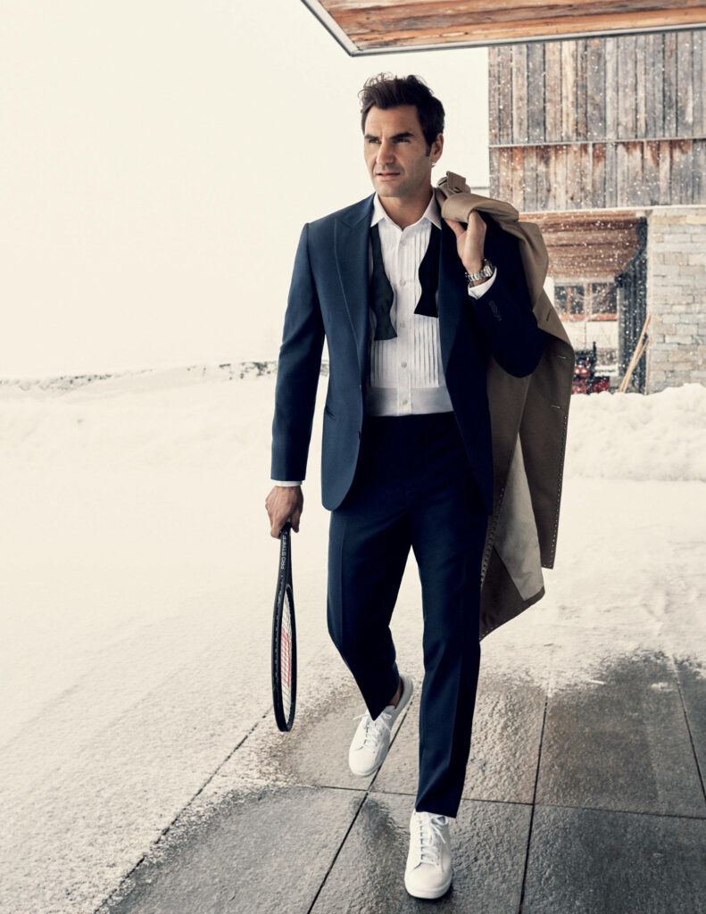 Elegant Roger Federer Wallpaper: Tennis Icon in Chic Snowy Setting