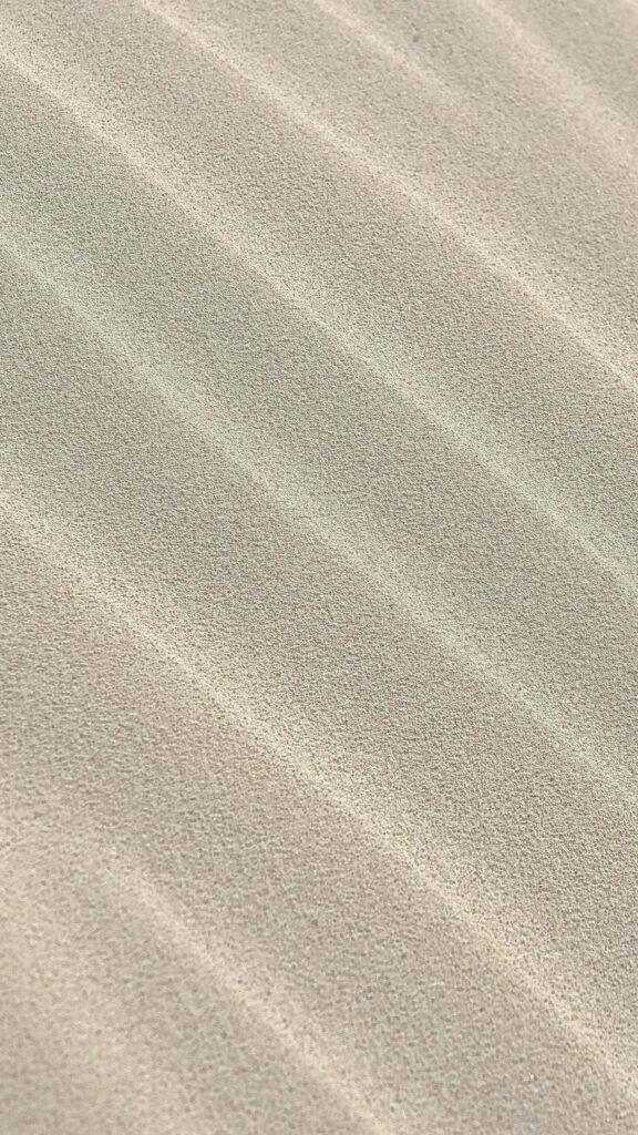Elegant Sand Textured Wallpaper Background with Symmetrical Design