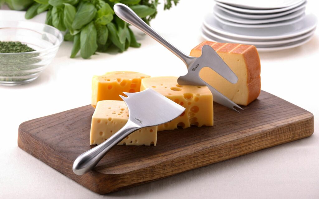 Elegant Cheese Display on Wooden Board - Perfect Wallpaper Background