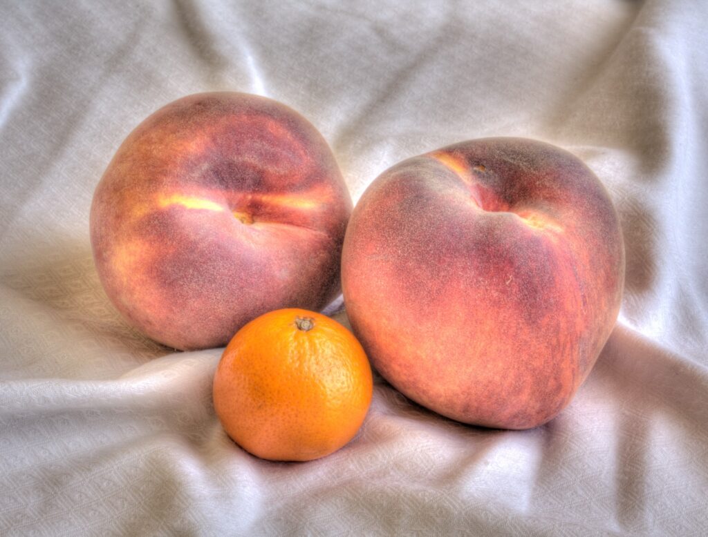 Beautiful Still Life Wallpaper: Peaches & Tangerine on Soft Background
