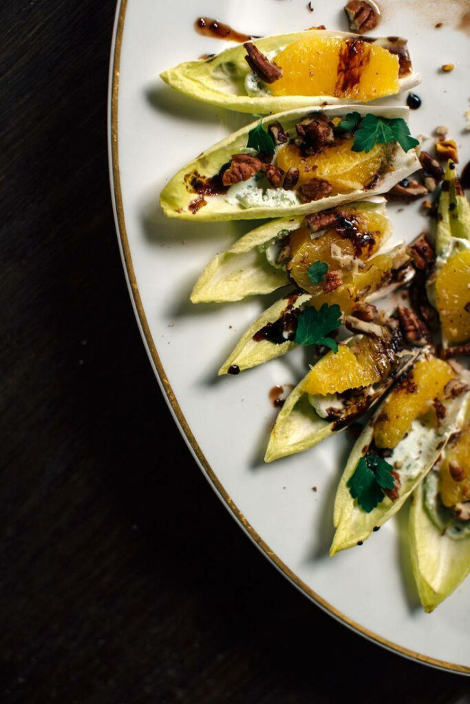 Elegant Stuffed Belgian Endive Appetizer: Vibrant & Nutty Wallpaper
