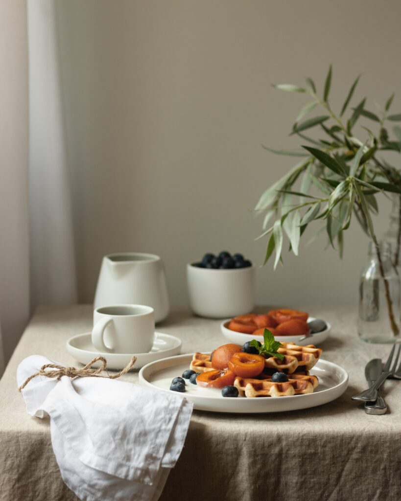 Elegant Tabletop with Viennese Waffles & Fresh Fruits Wallpaper