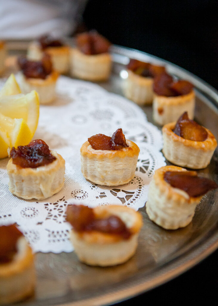 Elegant Tarts on Decorative Tray: Flaky Pastry Wallpaper Background