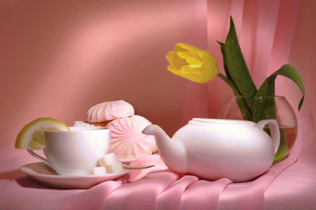 Elegant Tea Set with Lemon & Tulip on Soft Pink Wallpaper