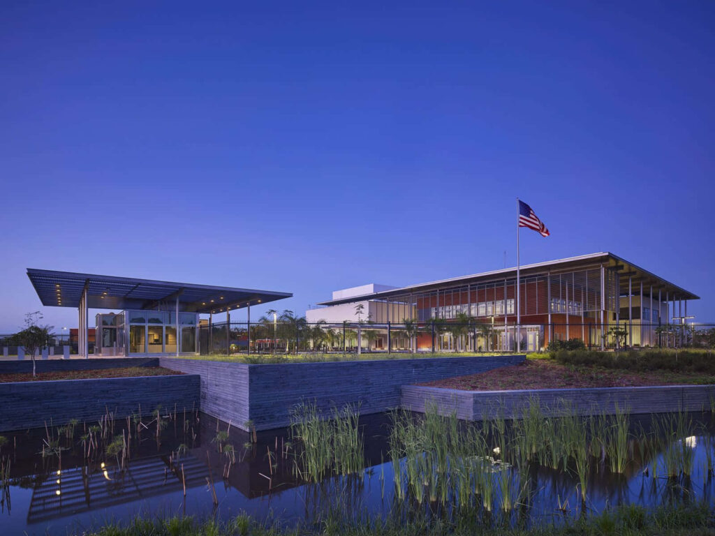 Elegant US Embassy Wallpaper: Modern Architecture & Serene Landscape