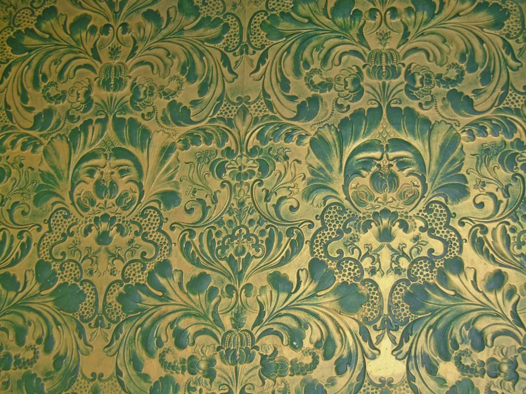 Elegant Victorian wallpaper with embossed emerald green damask and metallic gold floral scrolls