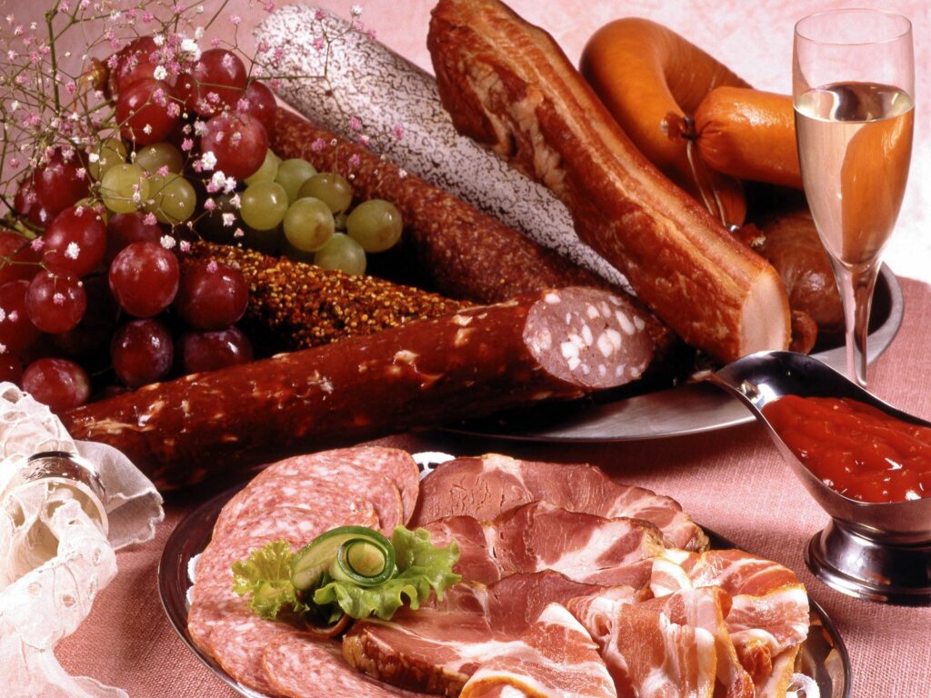 Elegant Meat and Cheese Spread with Grapes and Champagne Wallpaper