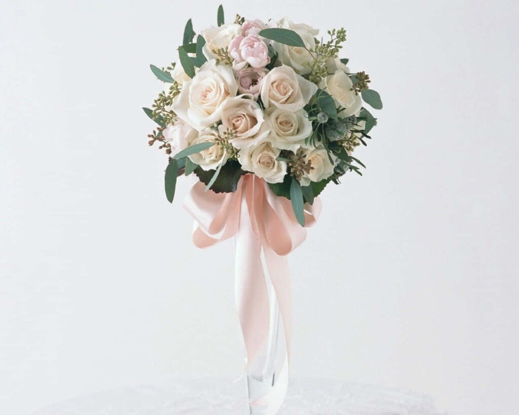 Elegant Wedding Flower Bouquet Wallpaper with Soft Pink Ribbon