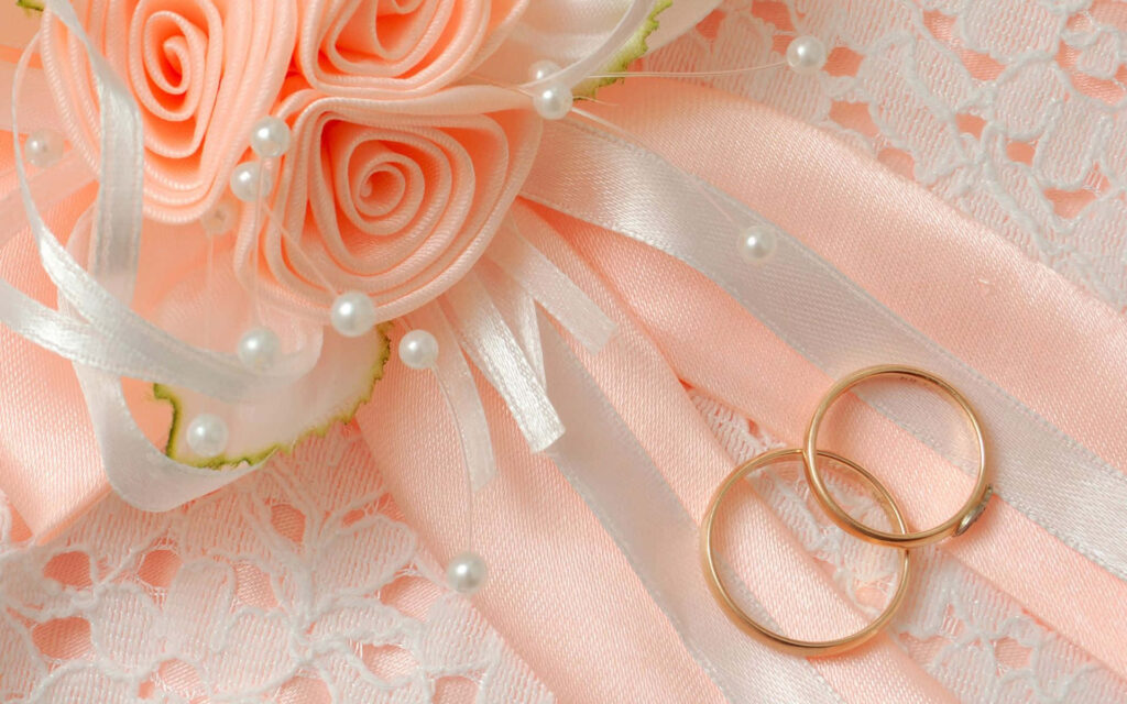 Elegant Wedding Wallpaper: Soft Pink Roses & Gold Rings Design