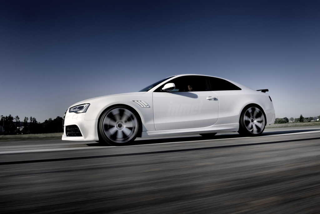 Sleek White Audi RS5 Wallpaper – Aerodynamic Luxury Coupe Design