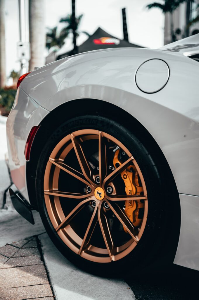 Sleek White Ferrari Wallpaper: Elegant Sports Car & Stylish Wheels