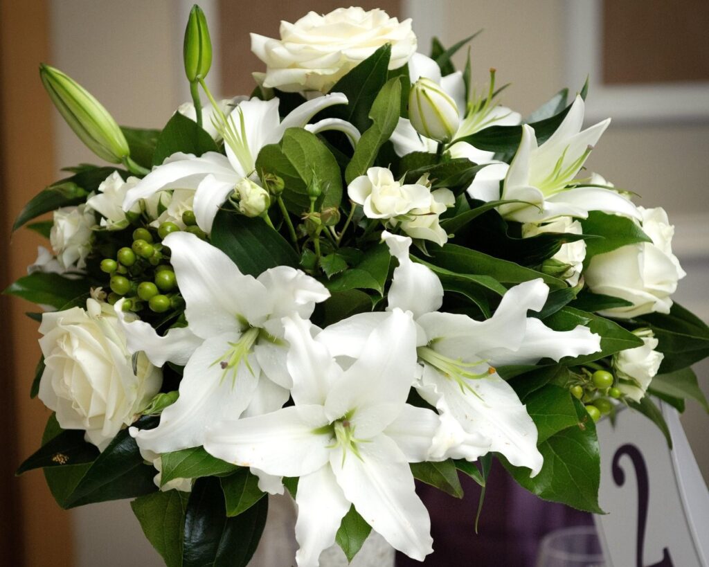 Elegant White Roses and Lilies Bouquet Wallpaper - Serene Floral Background