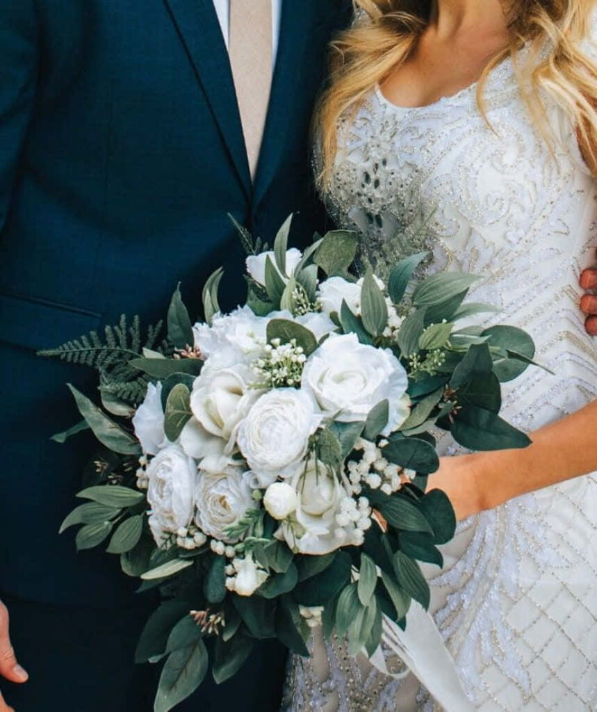 Elegant White Rose Bouquet Wallpaper with Lush Greenery Background