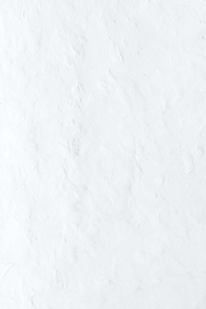 Minimalist White Wall Wallpaper: Textured Subtle Background Design