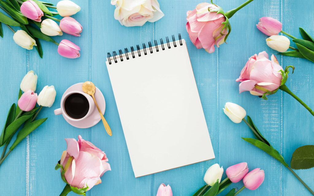 Floral Serenity: A Beautiful Bouquet with Delicate Note-Taking Accents Wallpaper