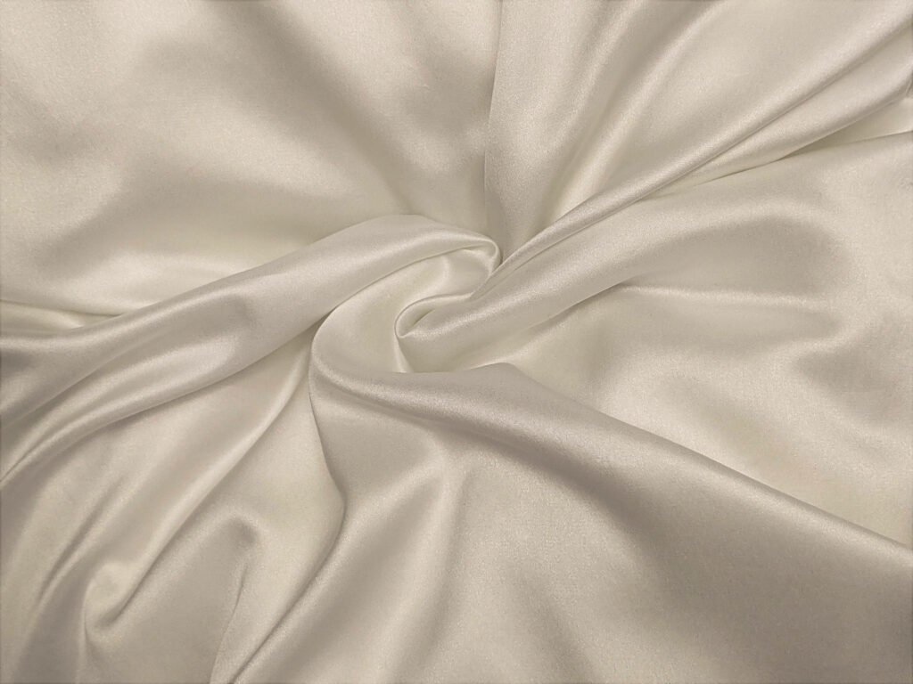 Twisted Elegance: Exploring the Graceful Contortions of White Silk Wallpaper
