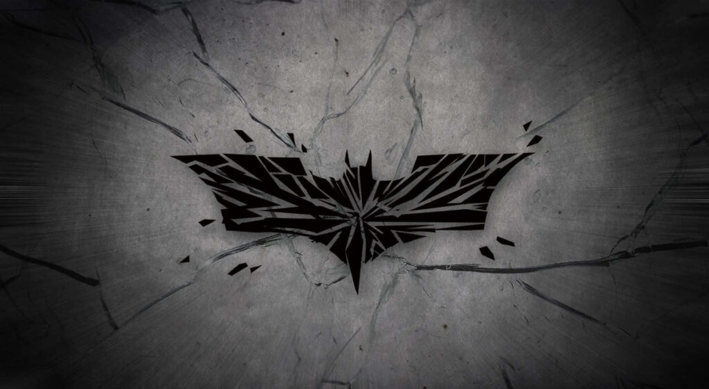 Cracked Elegance: A Chic Batman Logo Embraced by a Stylish Background, Perfect for the Dark Knight Laptop Aesthetic Wallpaper