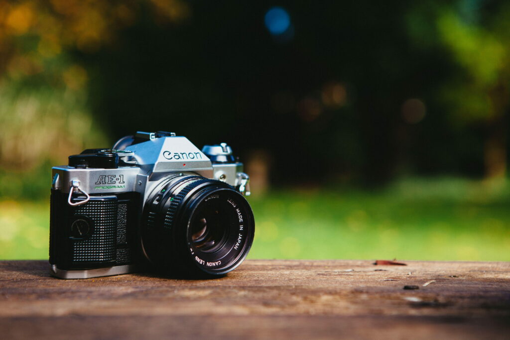 Capturing Life's Moments: HD Wallpaper of a DSLR Camera with Stunning Background