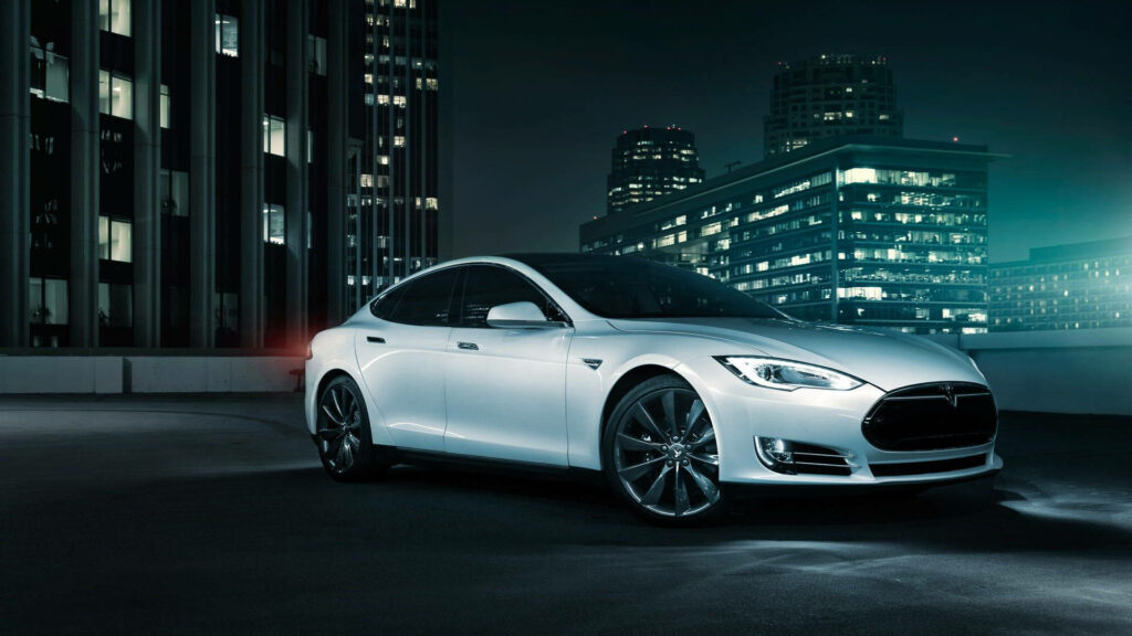 Electric Elevation: A Stunning White Tesla on a Rooftop with City Skyline Background Wallpaper