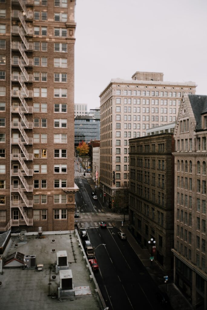 Elevated Urban Cityscape Wallpaper: Historic Charm Meets Modern Life