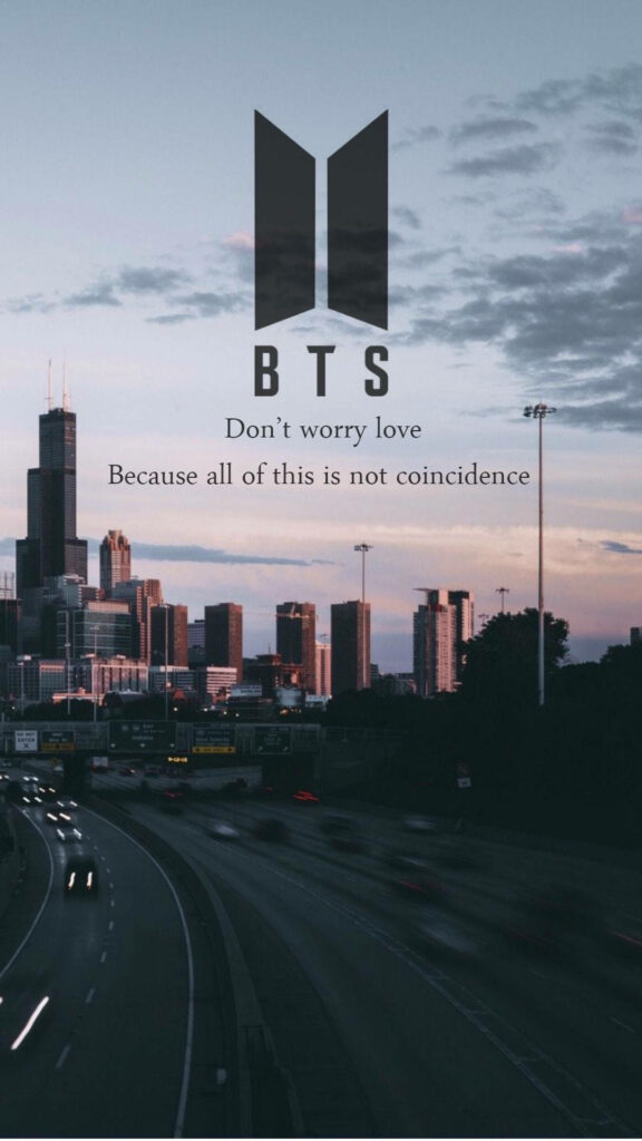 Urban BTS Bliss: The Iconic Logo Shines Amidst a Skyline and Cityscape Wallpaper
