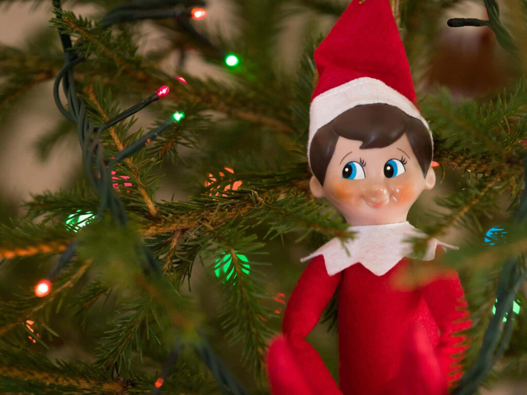 Cheerful Elf on the Shelf Christmas Tree Wallpaper Background