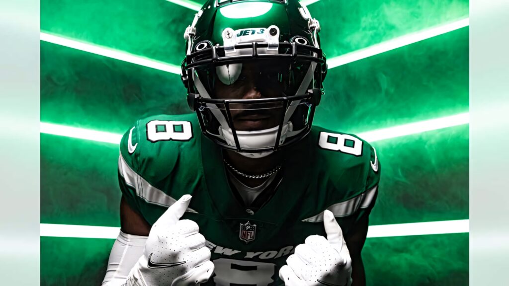 Elijah Moore New York Jets in green white uniform with visor intense pose dynamic green NFL backdrop Wallpaper