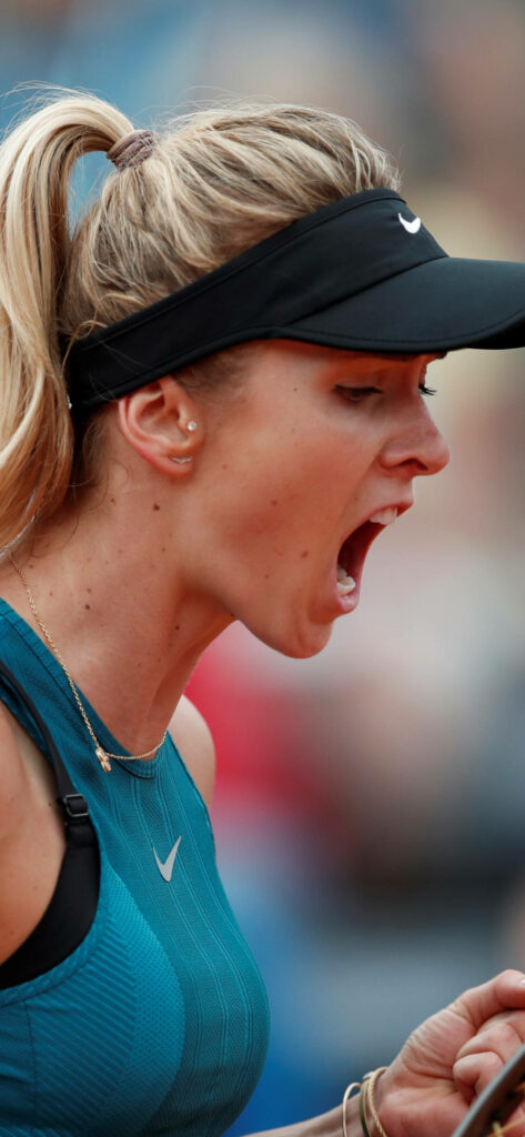 Elina Svitolina side profile shouting showing intense focus and competitive energy on tennis court Wallpaper